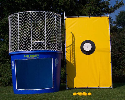 Players throw balls at target to send someone into the Dunk Tank